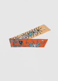 Colorful woven scarf with floral and butterfly patterns, made of natural materials.