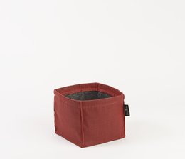 A red, square plant pot made of fabric material. The pot has a sturdy, durable construction and is suitable for indoor or outdoor use.