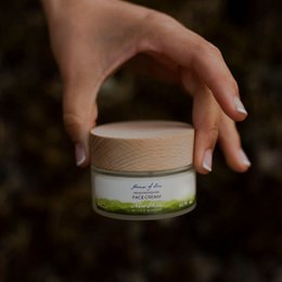 Highly nourishing face cream made with natural, vegan, and clean beauty certified ingredients. Scandinavian skincare product with a creamy texture and green packaging.