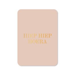 A greeting card with the text "Hip Hip Hooray" in gold foil on a light pink background.