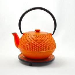 Orange cast iron teapot with a textured surface and a round shape. Suitable for brewing tea or coffee.