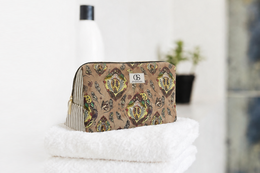 Floral patterned toiletry bag, beige and brown damask design, compact travel organizer.
