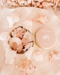 Peach seashell wax melts, coastal aesthetic, shell-shaped pieces, beachy scent, decorative tin jar.