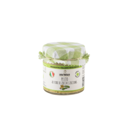 Organic pumpkin flower and zucchini pesto made in Italy, with green and white color scheme.