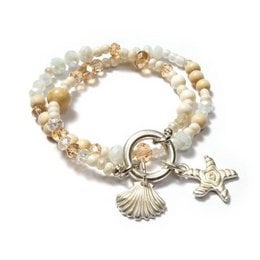 Bracelet with beads in shades of white, gold, and brown. Features charms including a shell and starfish.
The bracelet features a mix of white, gold, and brown beads in various shapes and sizes. The charms include a silver-toned shell and a starfish, adding a nautical and coastal vibe to the design. The bracelet has a layered, textured appearance that would complement a variety of casual or dressy outfits.
