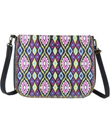 Ikat-patterned shoulder bag with adjustable strap and zipper closure.