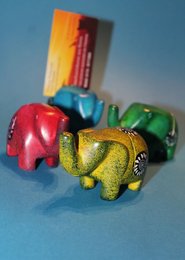 Colorful soapstone elephant-shaped business card holder with a unique and whimsical design.