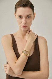 Fed minimalistisk guldrutileret kvarts bred bangle