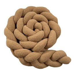 Camel-colored braided bed cushion with a rose-like design, suitable for a child's bedroom.
