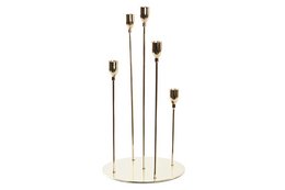 Tall, golden metal candle holder with 5 candle holders arranged in a circular pattern on a round base.
