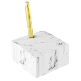 A white marble-patterned cube with a gold metal pen holder on top. This notebook accessory has a sleek, modern design that would complement a variety of office or home decor styles.
