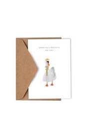 A white duck with a yellow beak and feet is featured on a Christmas card. The card has the text "WISHING YOU A SWANTASTIC NEW YEAR" printed on it, along with the Studio KATHAN logo.