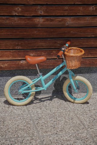 Balance bike in pastel blue color with wicker basket Isabelle Rose