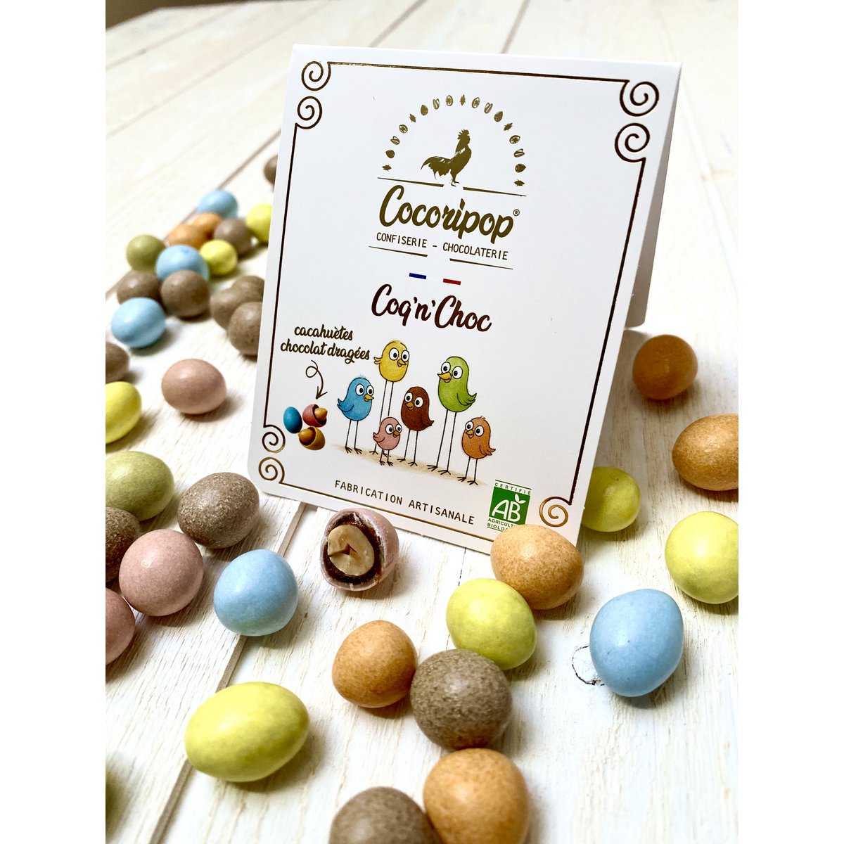 Coq 'n' shock (peanut chocolate dragee)