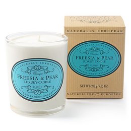  A tall, round white candle with a freesia and pear scent. The candle is packaged in a beige box with a teal label featuring the product name.