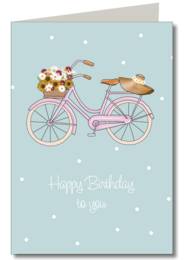 Vélo avec panier de fleurs