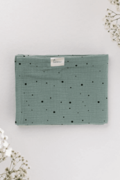 Soft, breathable muslin swaddle blanket in a sage green color with small white polka dot pattern. Suitable for newborns and infants.