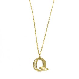 Gold-tone necklace with a half diamond-encrusted letter Q pendant.