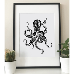 A black and white illustration of an octopus with intricate, patterned tentacles. This wall art piece would be suitable for a modern or minimalist home decor.
