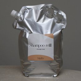 Large 5L refill bottle of orange-scented shampoo with natural ingredients.