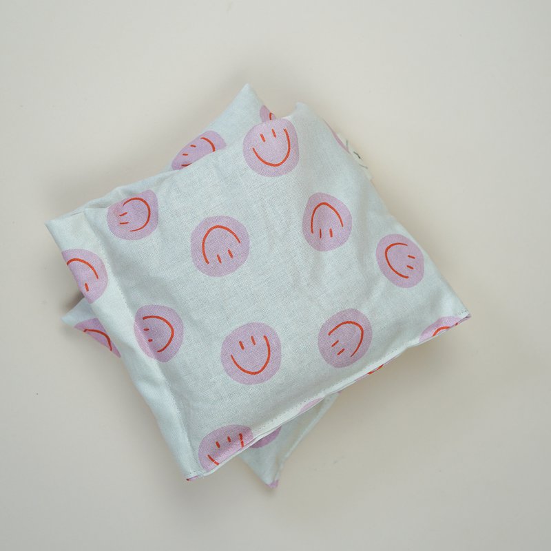 Katoenen warmtekussen gevuld met biologische spelt Smiley Pink