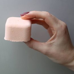 Revitalising aromatherapy shower steamer, pink in color, made of natural ingredients.