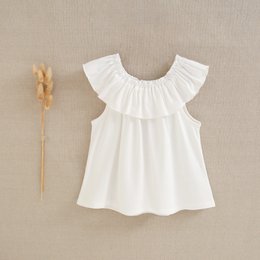 Girls' flowing white T-shirt with ruffle collar, available in sizes 3 to 12 years.