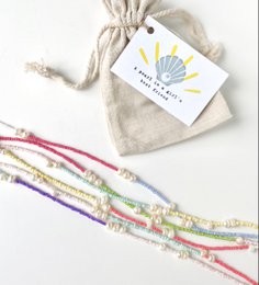 Boho style necklace with assorted freshwater pearls. Delicate, colorful beaded necklace with natural pearls in a variety of pastel shades.