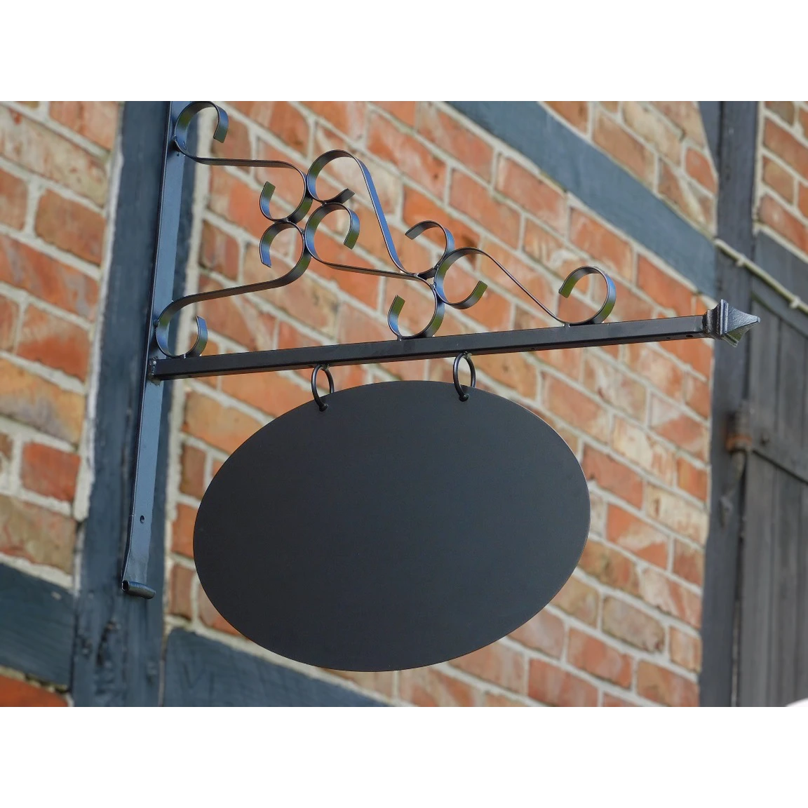 Iron shop sign – black powder-coated – romantic – oval wall-mounted model