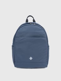 A round, blue backpack with a minimalist design and adjustable straps for comfortable carrying.