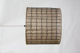 A cylindrical lampshade made of jute material, suitable for pendant lighting fixtures.