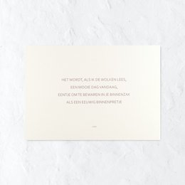 A romantic love card with a handwritten message and a sprig of greenery.