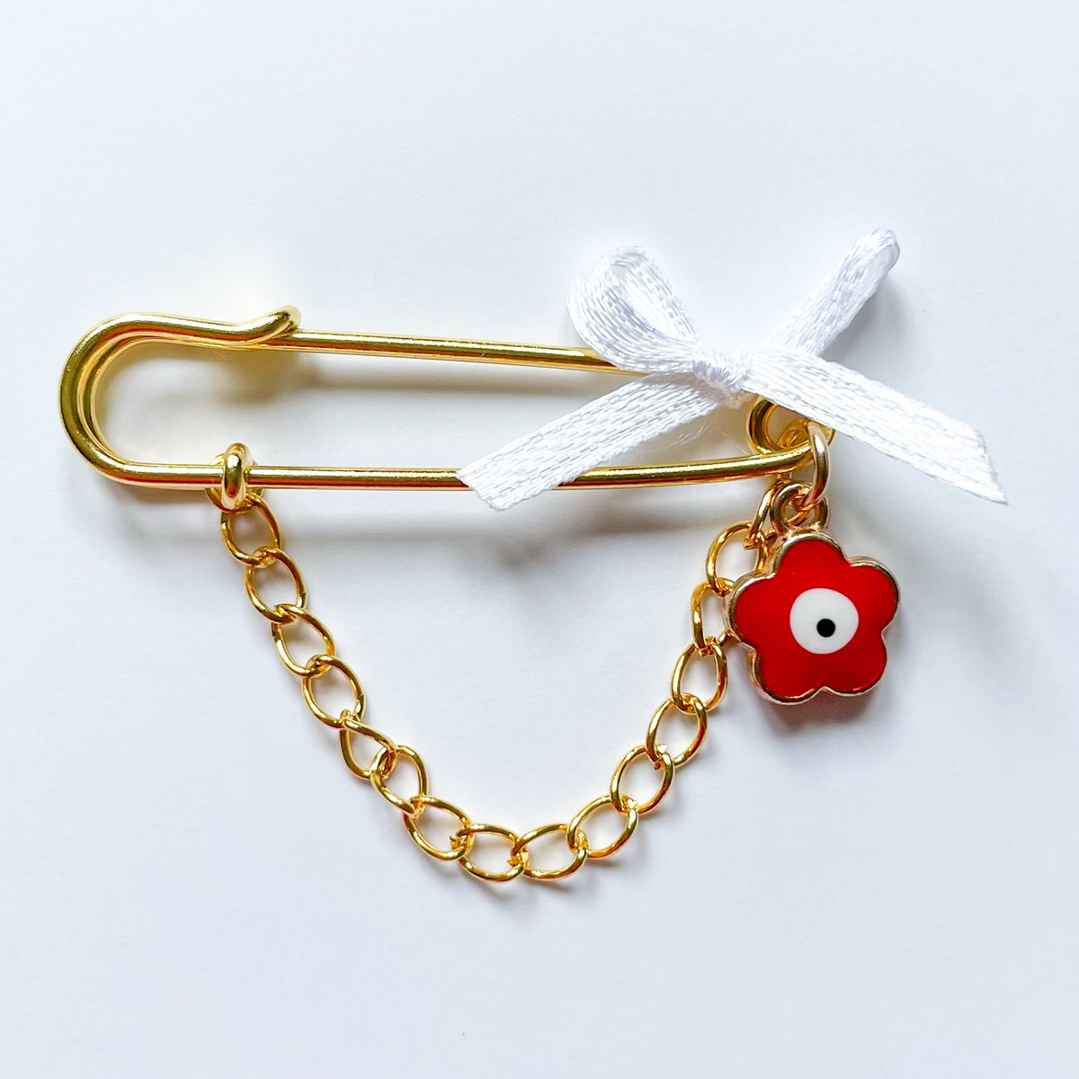 Pin lucky charm as a gift for birth with Evil Eye in red and chain