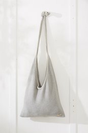 Gray knitted cotton shoulder bag with stitching detail.