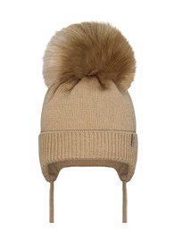 Beige baby hat with a large brown faux fur pom-pom. Made of soft, warm knit material. Available in sizes 1-3 months and 3-6 months. Suitable for keeping baby's head cozy in cool weather.
