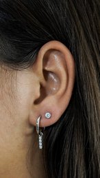 Silver-toned drop earrings with a row of sparkling zirconia stones, creating a classy and elegant look.