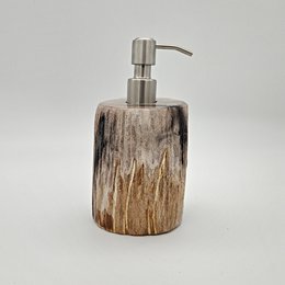 Petrified wood soap dispenser with a natural, rustic appearance and a stainless steel pump.