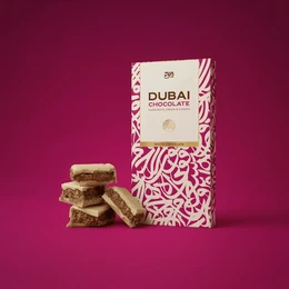 White chocolate hazelnut kunafa bar, rectangular shape, pink and cream packaging, decorative pattern, luxury gift chocolate.
