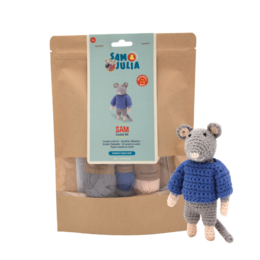 Crochet Kit - Sam: A DIY craft kit containing yarn, crochet hook, and instructions to create a blue crocheted figure. The kit includes materials for a handmade, customizable craft project.