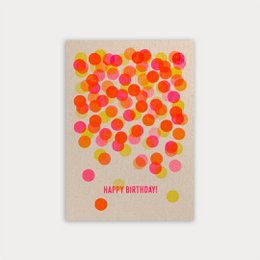 Colorful confetti-style birthday card with the text "Happy Birthday!" printed in pink. The card features a vibrant pattern of overlapping circular shapes in shades of orange, pink, and yellow.