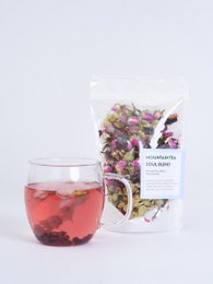 White tea soul blend in a beige paper bag with a label and dried tea leaves.