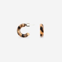 Tortoiseshell-patterned hoop earrings with a charming, cookie-like appearance.