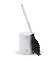 A white toilet brush with a black bristle head. The brush is made from bio-sourced and recycled materials.