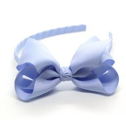 Pastel blue bow headband with large bow for kids' hair accessories.