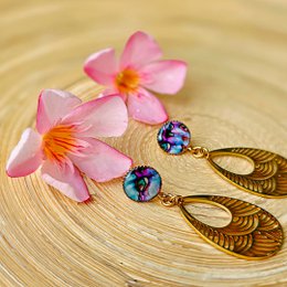 Elegant mother-of-pearl drop earrings with delicate gold-tone accents.
