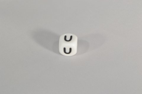 Perlensilikonbuchstabe U.