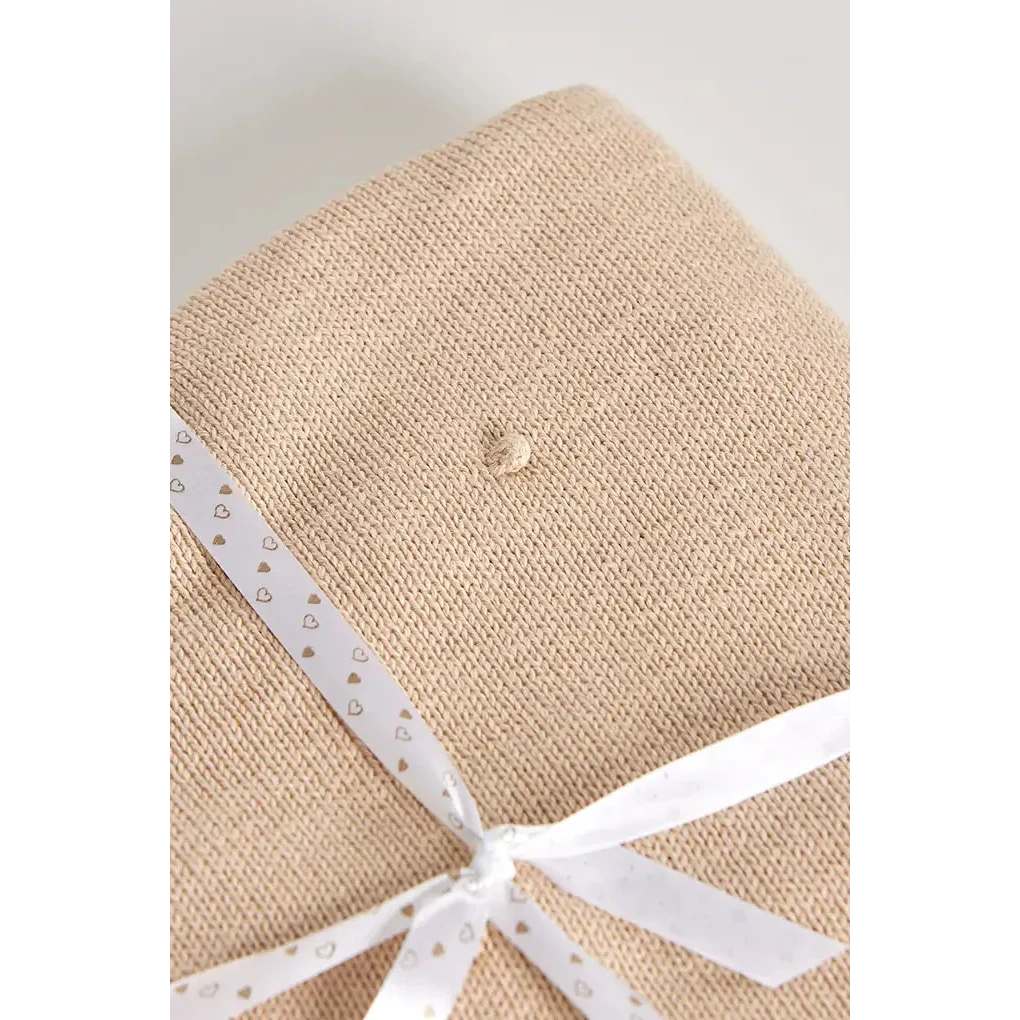 Coperta in maglia di cotone per bambini con pompon