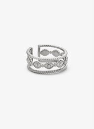 Silver-colored statement ring with intricate, textured design.
