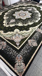 Large dark blue area rug with intricate floral and geometric patterns, suitable for living rooms or bedrooms.