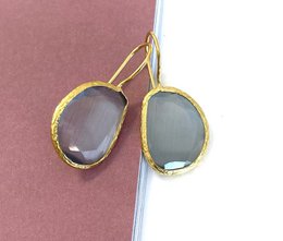 Gray cat-eye stone drop earrings with gold-tone metal frame.